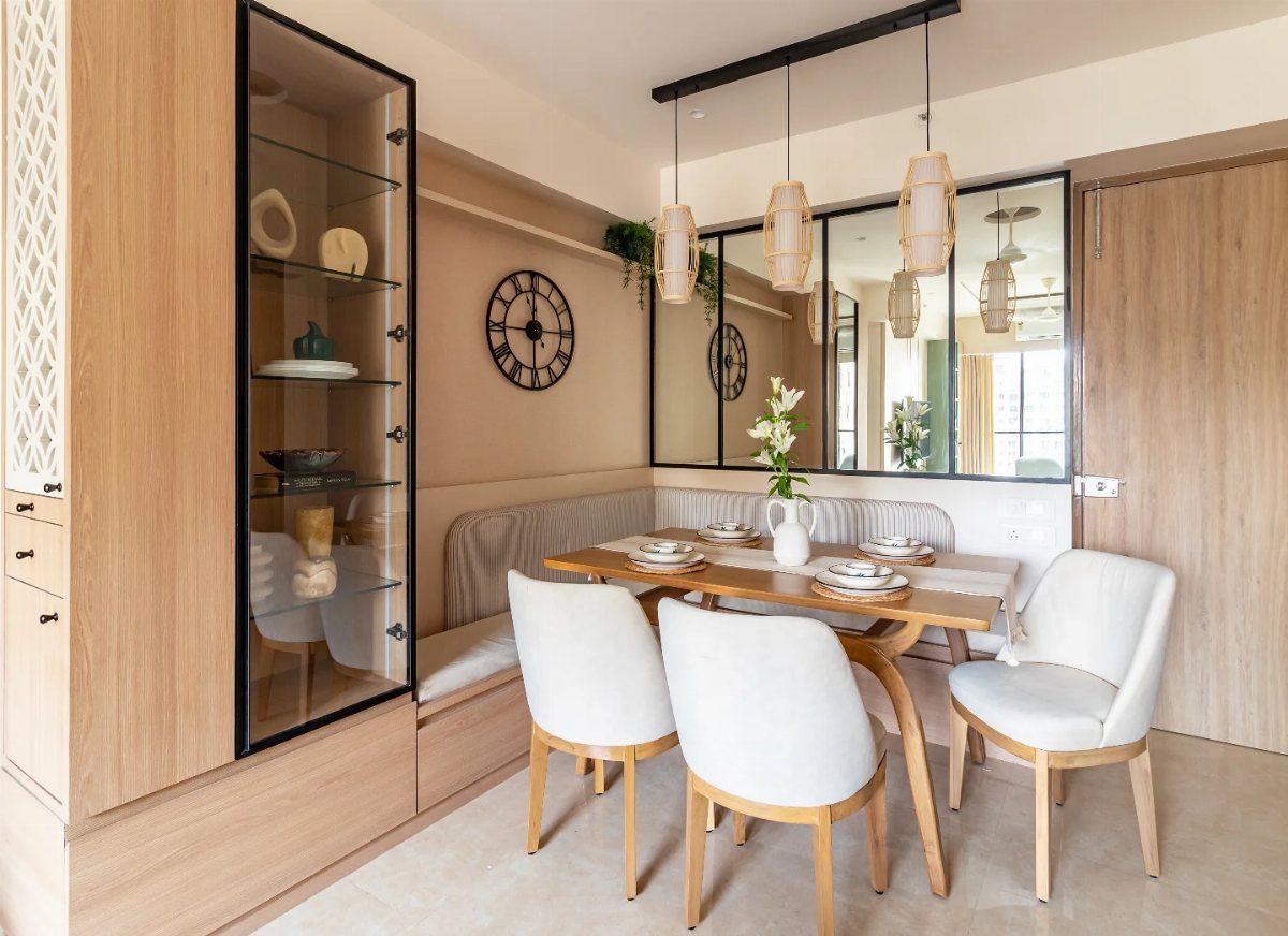 Light wood built-in corner cabinet with glass door in a modern dining room.