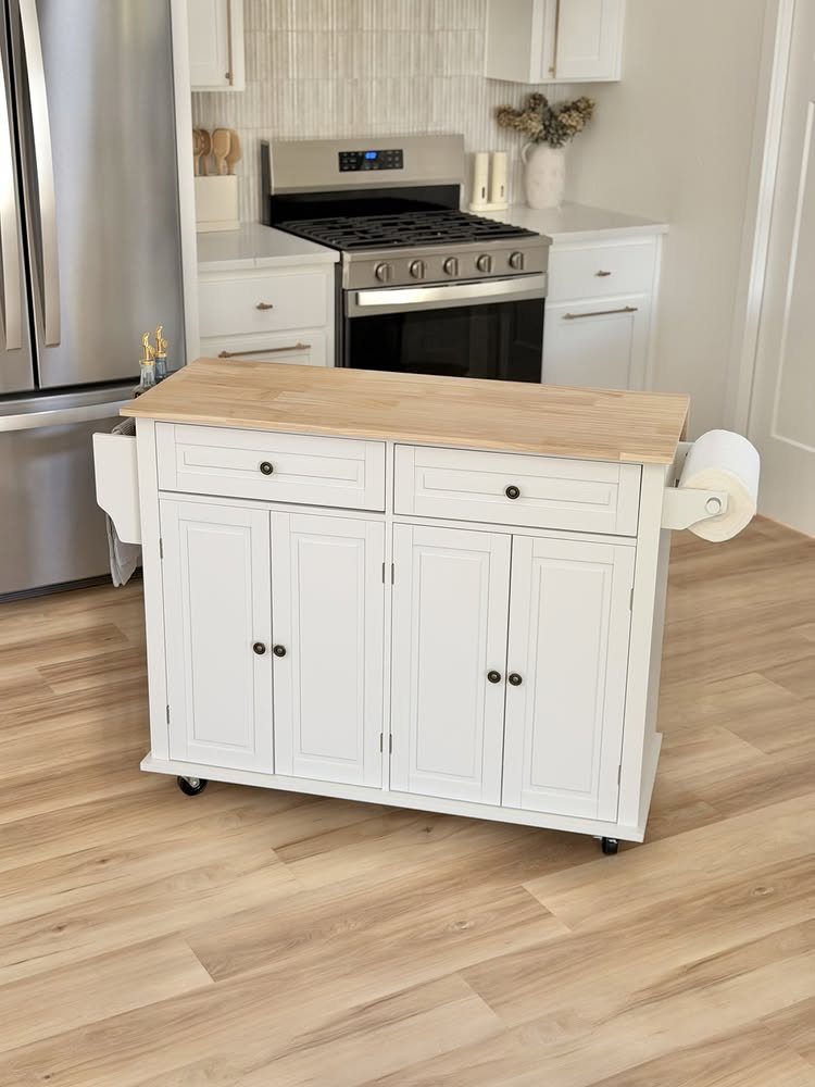 White wooden kitchen storage cart with light wood top and rolling wheels.