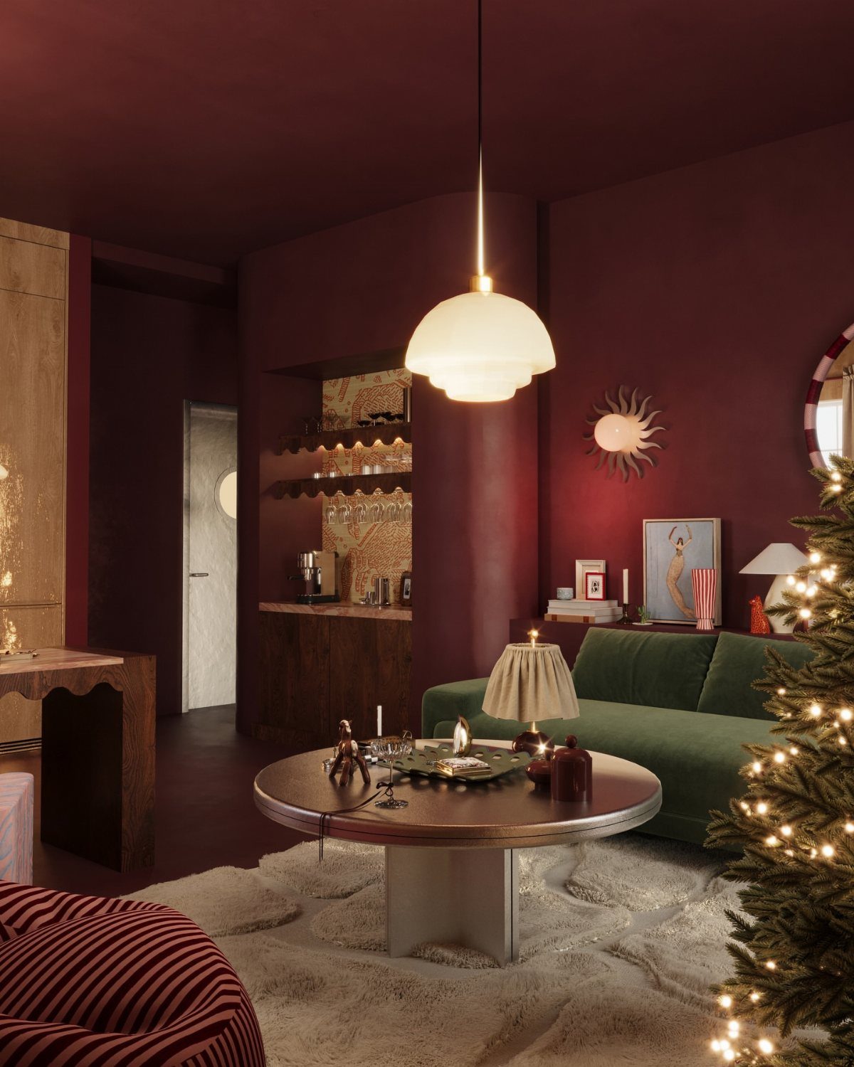 Burgundy walls and ceiling contrasting with a green velvet sofa in a living room.