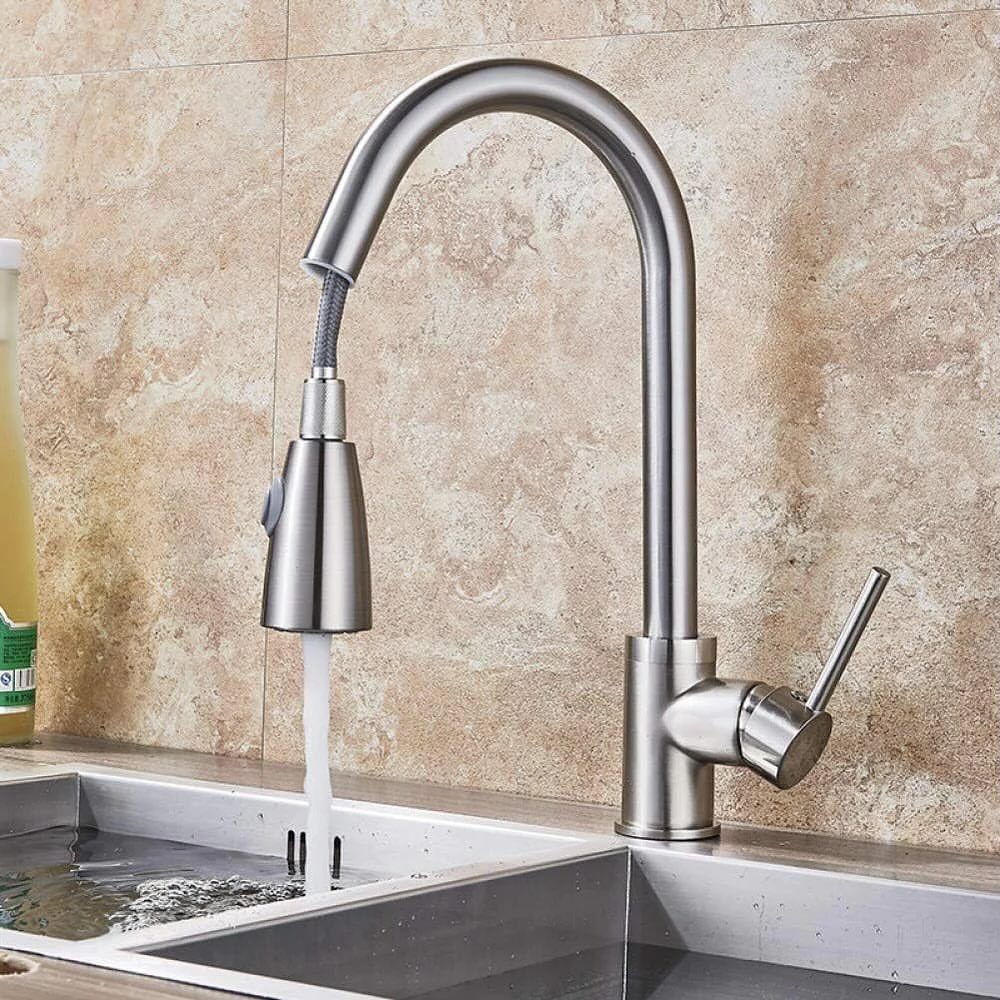 Brushed nickel high-arc kitchen faucet with pull-down sprayer dispensing water into a sink.