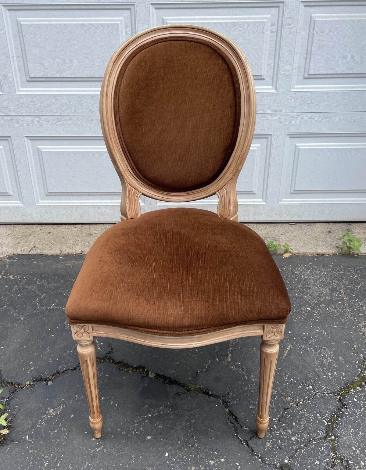 Louis side chair with tan velvet upholstery and floral carvings on wooden frame