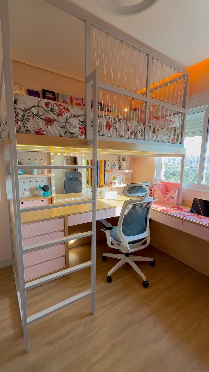 White metal loft bed with a desk and pink drawers underneath in a bedroom.