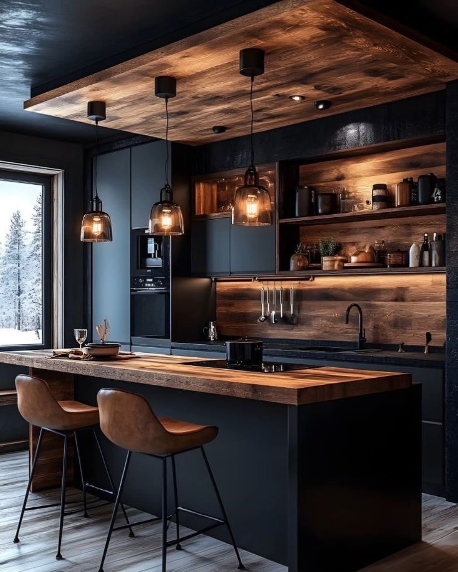 Modern kitchen with matte black cabinets, dark wood countertops, and leather bar stools.